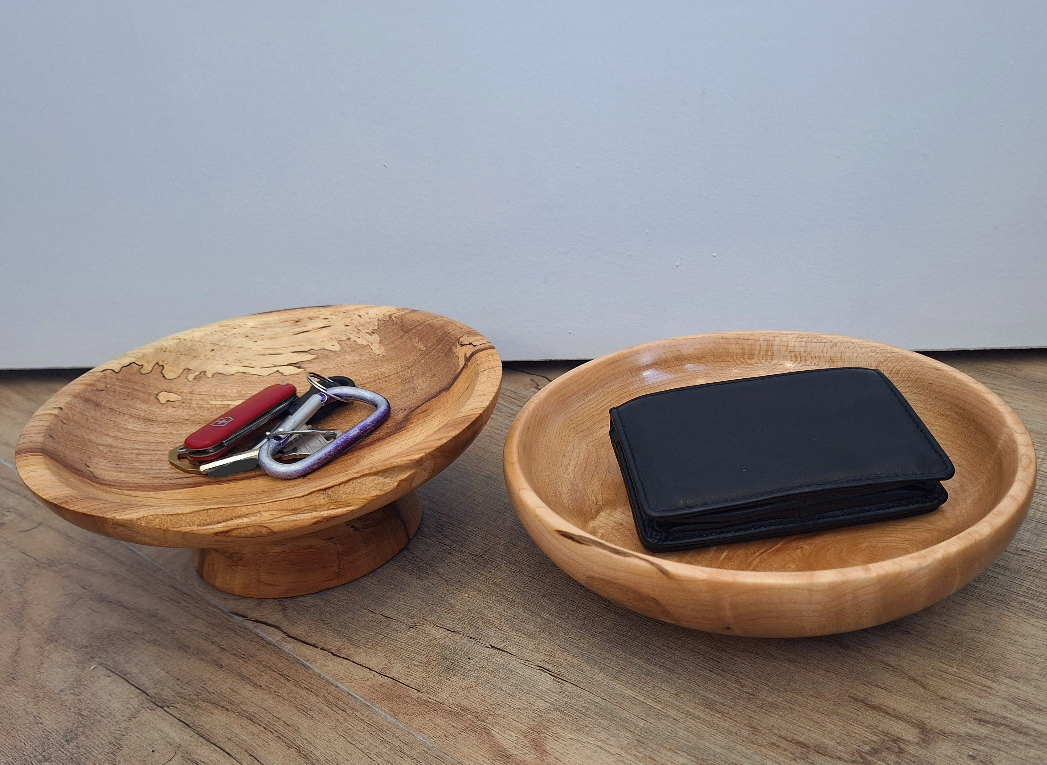 Two more bowls holding a wallet and keys
